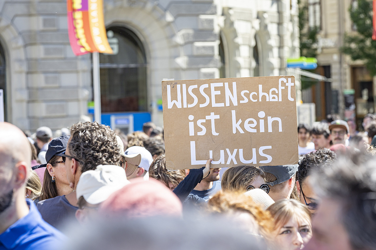 A sign reading: "Science is not a luxury"