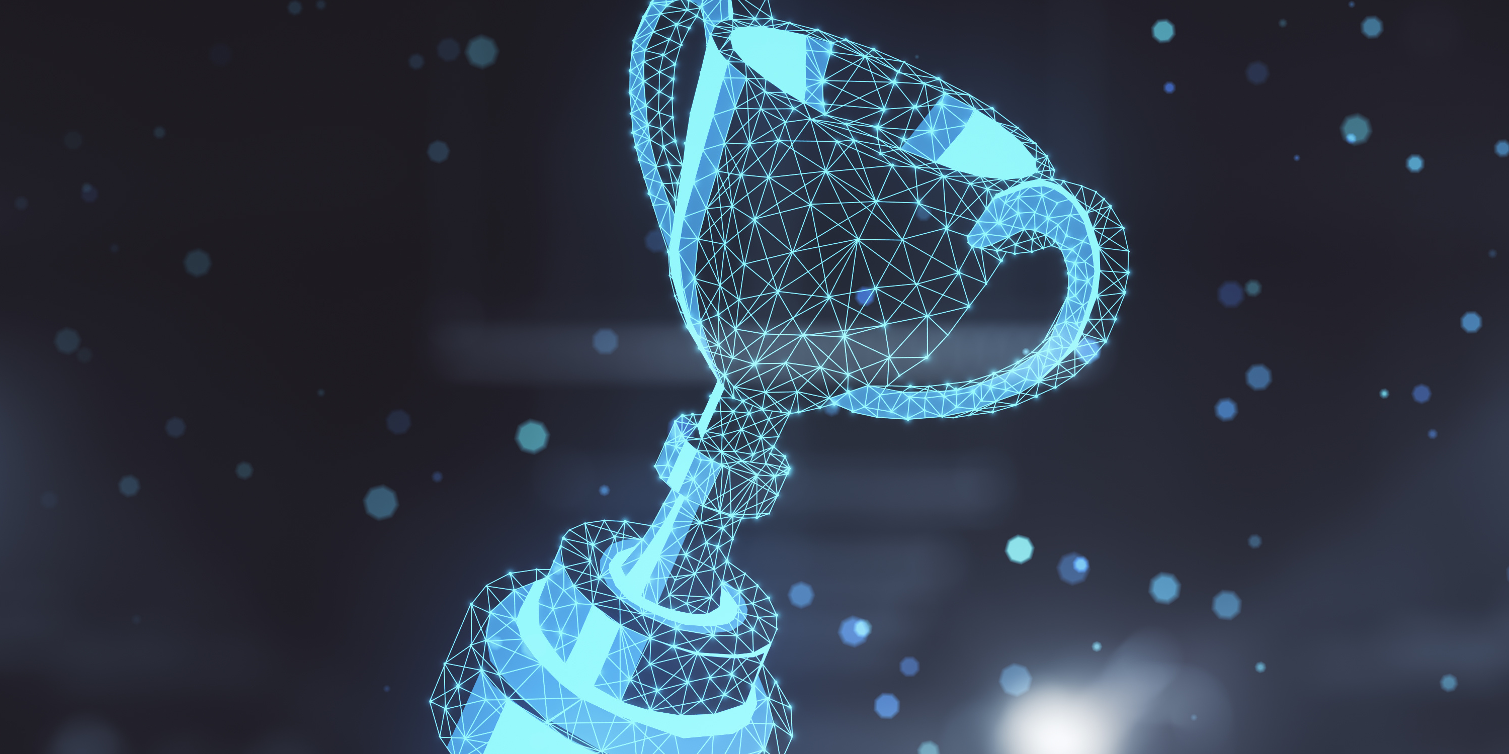 Eine Hand hält ein Tablet über dem ein 3D-Hologramm eines Pokals schwebt